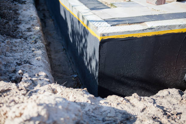 Professional Waterproofing technician working in Caledonia, WI